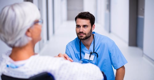 Young doctor with older patient