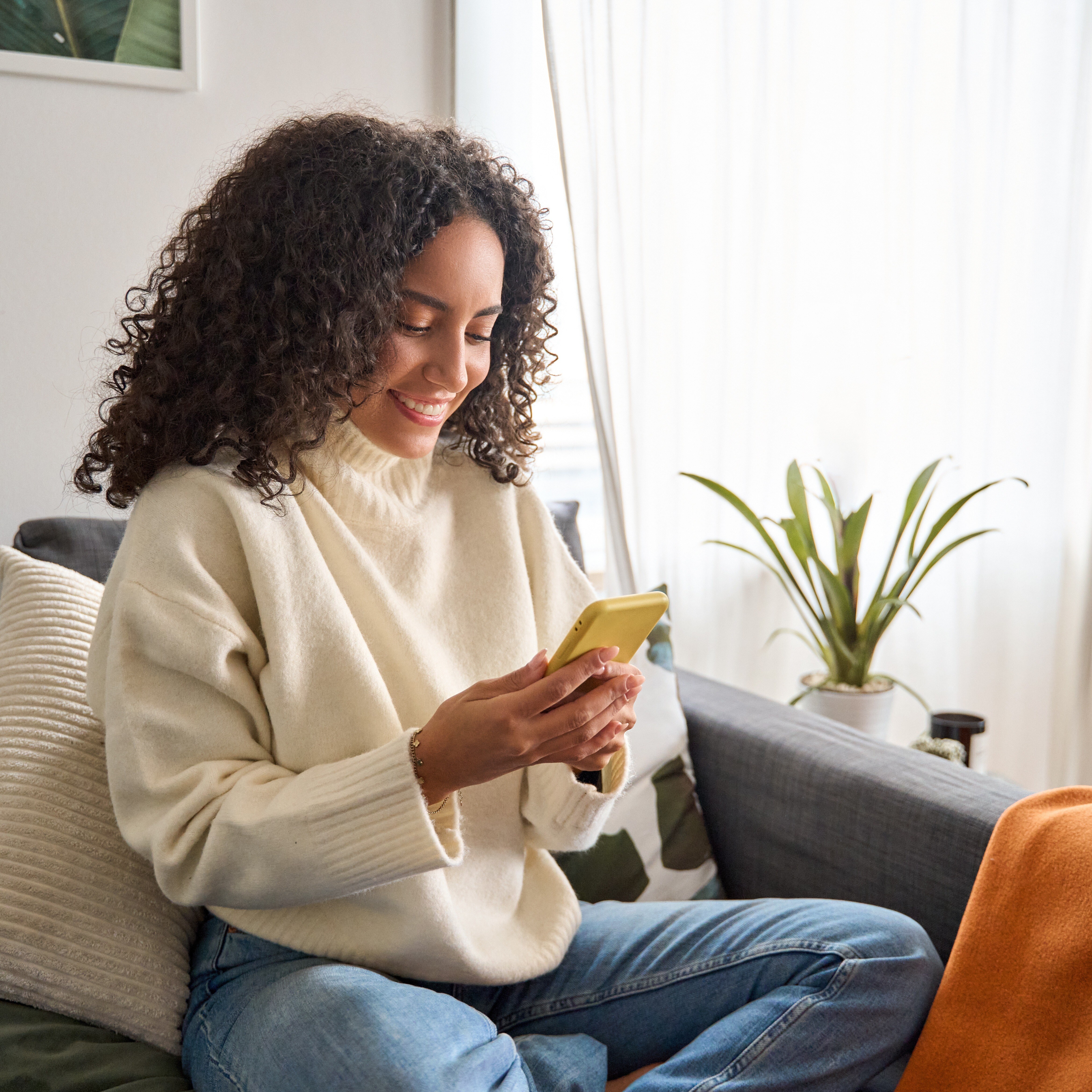 Woman smiling at phone